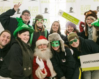 New City Moving employees pose with Santa Clause at St Jude event