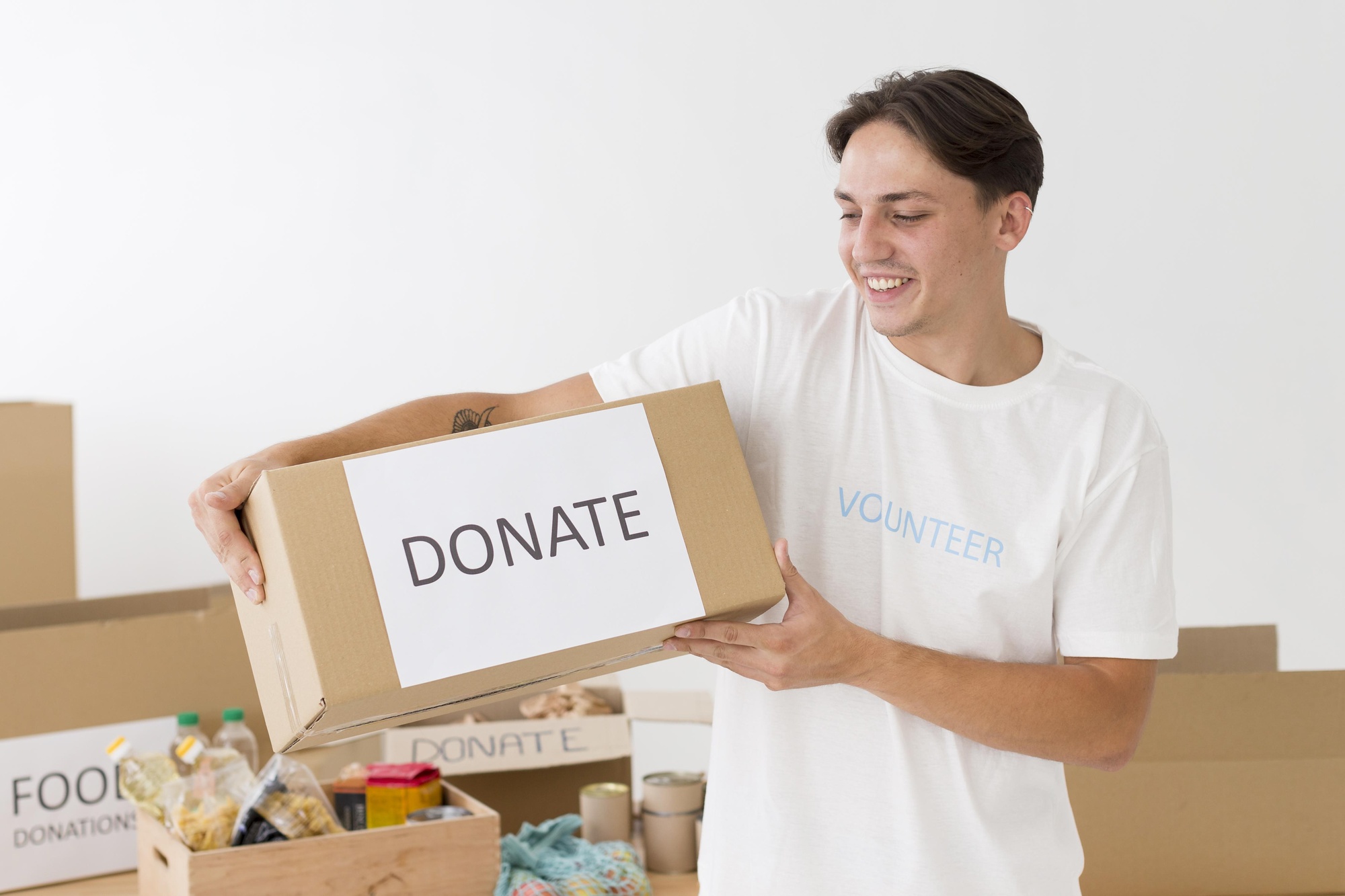 volunteer holding donate box